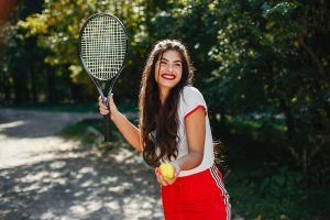 Beautiful and stylish girl on the tennis court