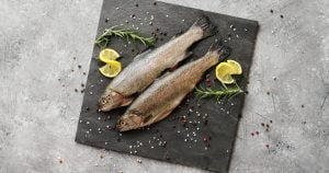 Fish with lemon on board
