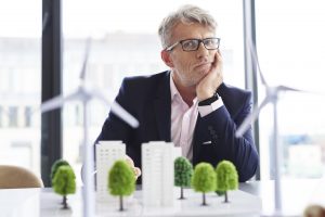 Portrait of tired businessman at work