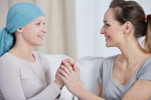 Woman supporting friend with cancer