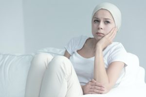 Woman with cancer sitting