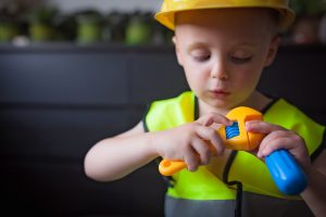 Boy playing as a foreman