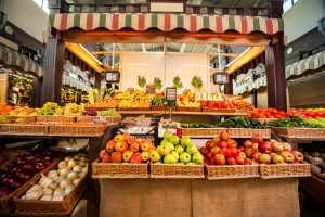 Counters with fresh fruits and vegetables.