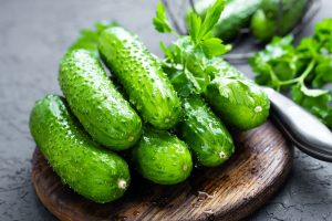 Cucumbers. Fresh cucumbers on wooden board