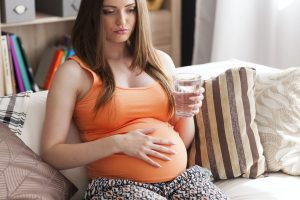 Pregnant young woman with nausea
