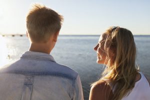 Man and woman standing on beach